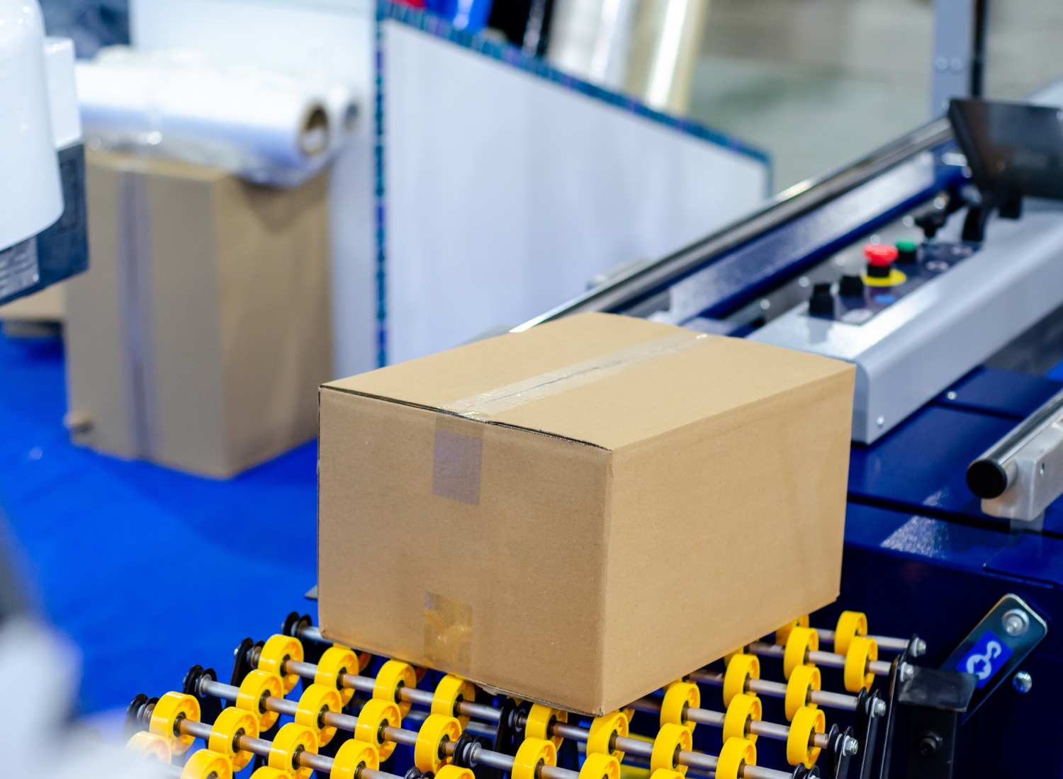Automated carton sealing line in a distribution facility